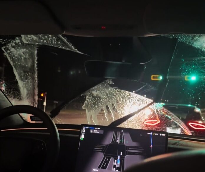 tesla-robotaxi-comes-with-a-custom-windscreen-washer-action.jpg Tesla Robotaxi comes with a custom windscreen washer action